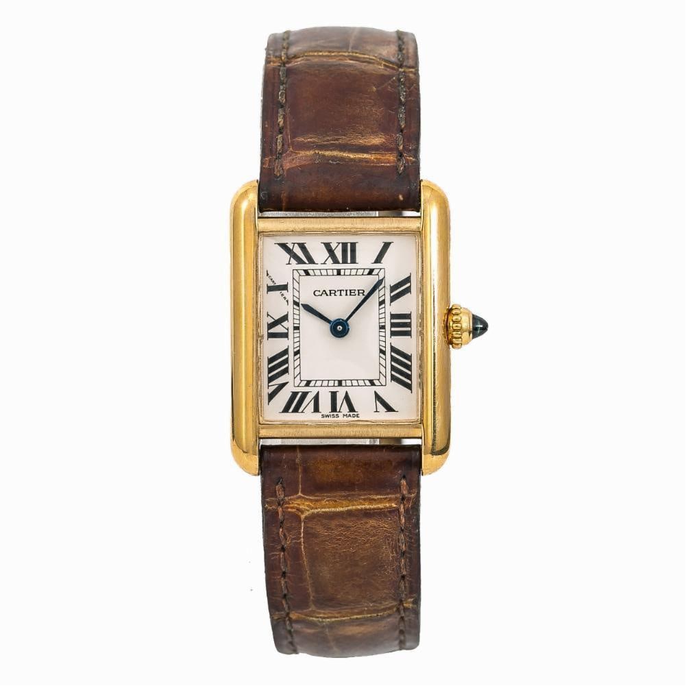 Cartier Tank White Dial Leather Watch Ref 2442 with Papers 2010: Cartier Tank White Dial Leather Watch Ref 2442 with Papers 2010 This exquisite Cartier Tank watch features a classic white dial, perfectly complemented by a luxurious 18K yellow gold case. Designed fo