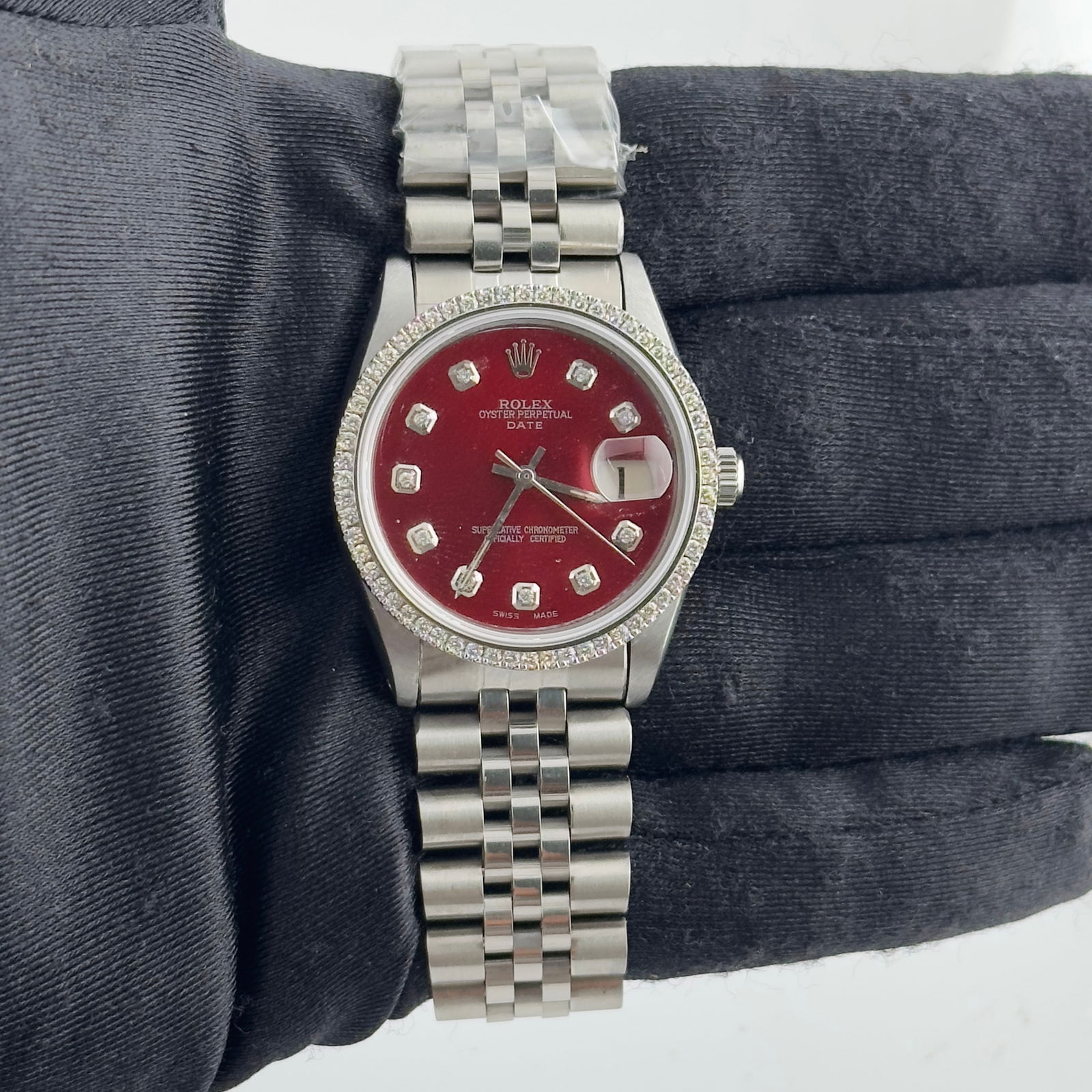 Rolex Date 6694 After Market Red Diamond Dial After Market Jubilee Bracelet: Rolex Date 6694 After Market Red Diamond Dial After Market Jubilee Bracelet This exquisite Rolex Date watch features a striking After Market Red Diamond dial, perfectly complemented by a prong bezel a