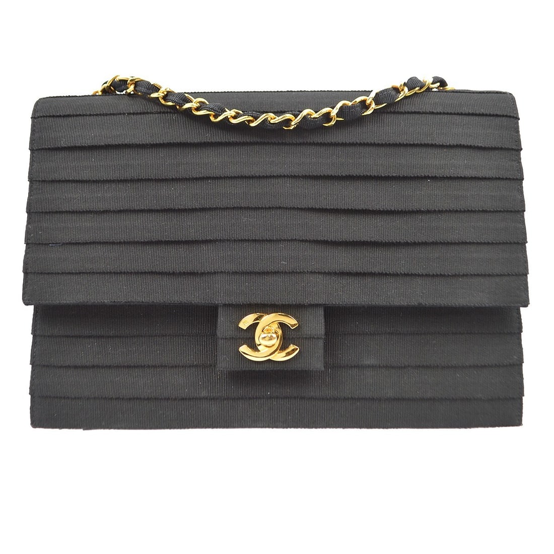 Chanel Black Canvas Flap Chain Shoulder Bag with Turn Lock: Chanel Black Canvas Flap Chain Shoulder Bag with Turn Lock This stylish Chanel Black Canvas Flap Chain Shoulder Bag is the perfect accessory for any occasion. It features a medium size with a chic des