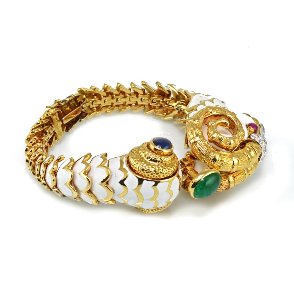 David Webb Platinum 18K Gold White Enamel Aries Ram Bracelet: David Webb Platinum 18K Gold White Enamel Aries Ram Bracelet This exquisite David Webb bracelet features a striking combination of platinum and 18K yellow gold, showcasing a flexible white enameled bo