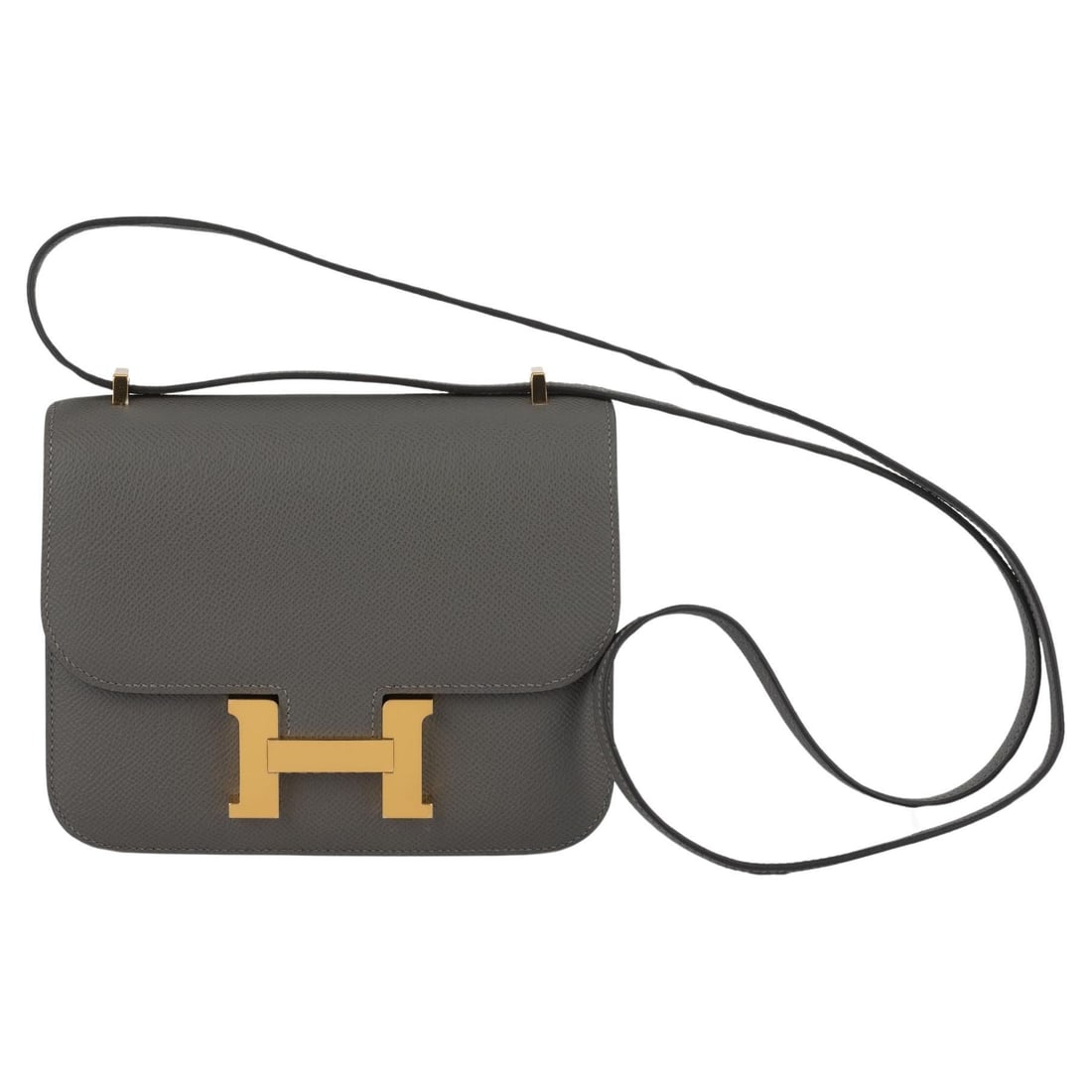 Hermes Mini Constance 18 Gris Meyer Epsom Leather Crossbody Bag: Hermes Mini Constance 18 Gris Meyer Epsom Leather Crossbody Bag Introducing the Hermes Mini Constance 18 in the elegant Gris Meyer shade. This exquisite crossbody bag is crafted from premium Epsom lea