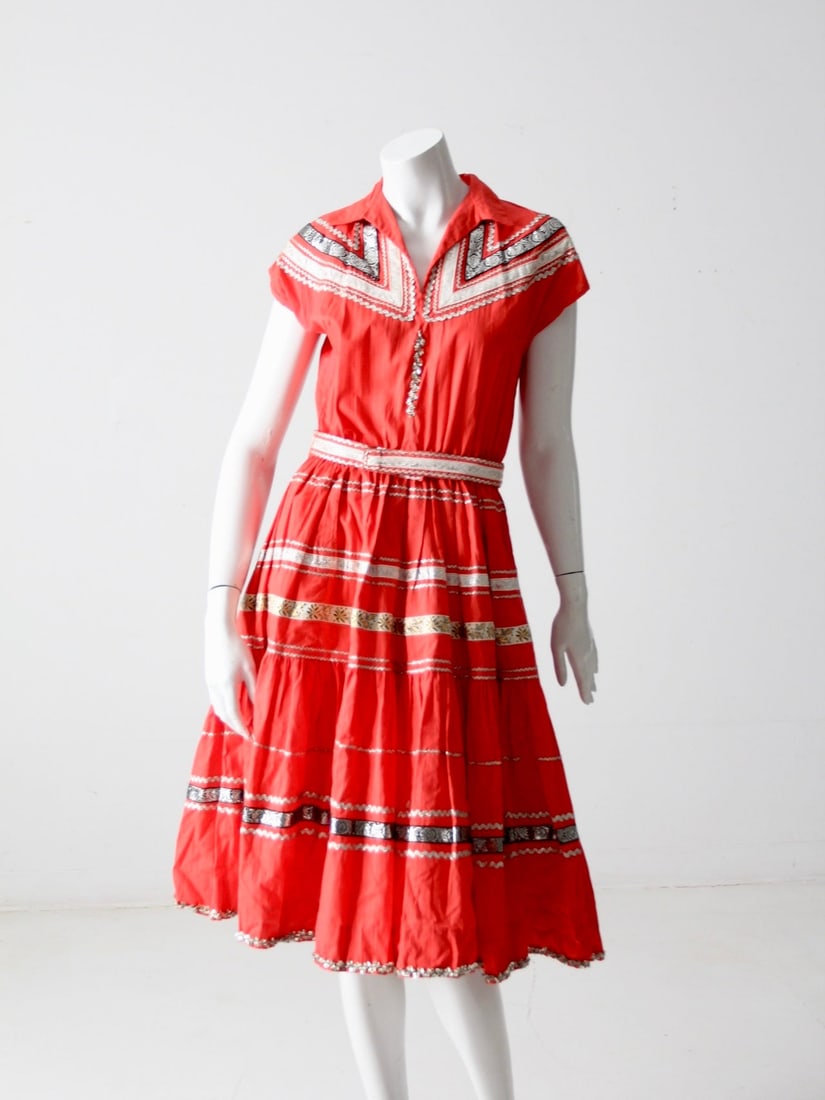 1950s Vintage Thunderbird Fashions Southwestern Dress with Belt: 1950s Vintage Thunderbird Fashions Southwestern Dress with Belt Step into a piece of history with this stunning 1950s vintage Thunderbird Fashions dress. Featuring a vibrant red fabric adorned with so
