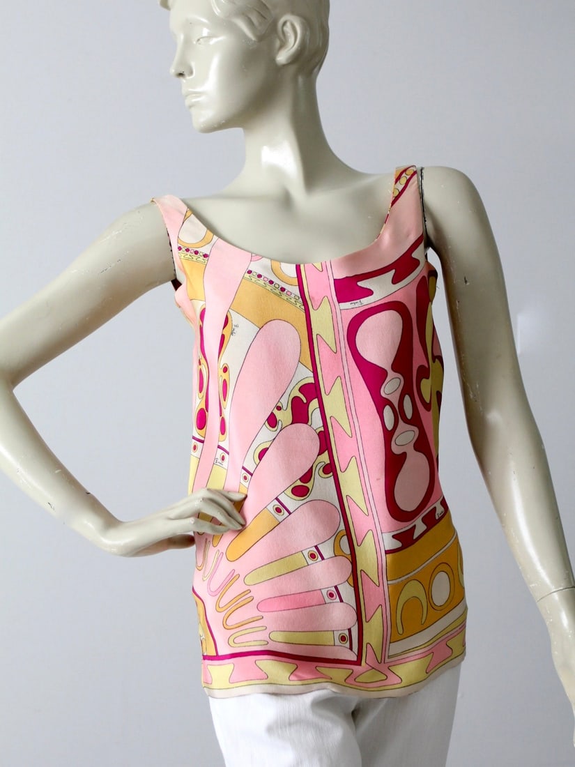 1960s Emilio Pucci Silk Blouse from Saks Fifth Avenue: 1960s Emilio Pucci Silk Blouse from Saks Fifth Avenue Discover a stunning piece of fashion history with this 1960s vintage Emilio Pucci silk blouse, originally from Saks Fifth Avenue. The blouse featu