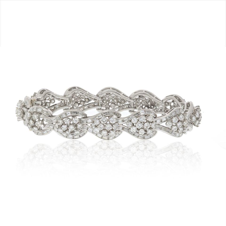 Vintage 1950s Platinum 22 Carat Round Baguette Diamond Bracelet: Vintage 1950s Platinum 22 Carat Round Baguette Diamond Bracelet This exquisite platinum diamond bracelet, crafted in the 1950s, showcases a stunning combination of round brilliant cut diamonds and sle