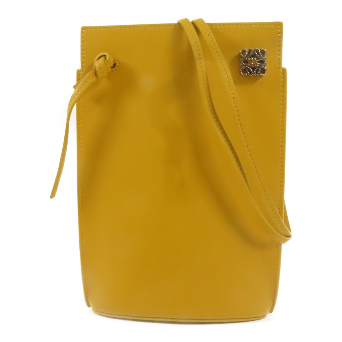 LOEWE Dice Pocket Yellow Calfskin Leather Shoulder Bag: LOEWE Dice Pocket Yellow Calfskin Leather Shoulder Bag Introducing the LOEWE Dice Pocket Shoulder Bag, a stylish accessory crafted from premium calfskin leather. This bag features a vibrant yellow ext
