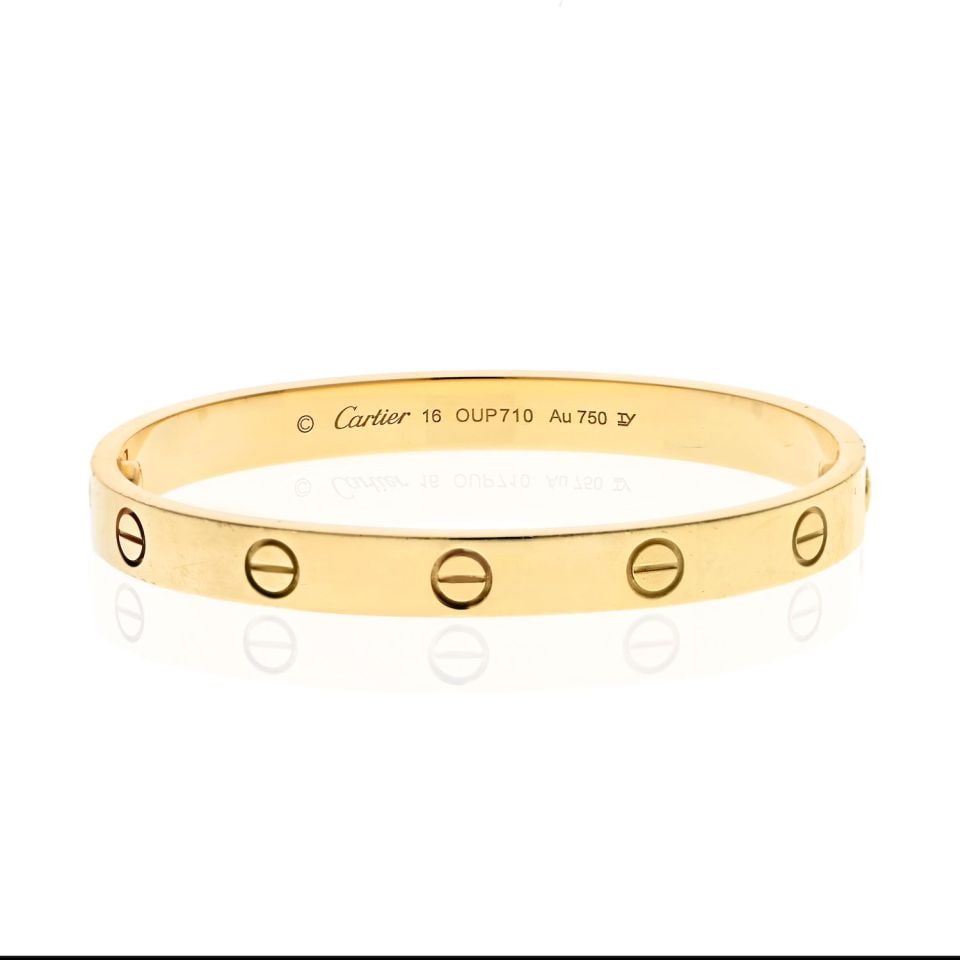 Cartier Love 18K Yellow Gold Bangle Bracelet Size 16: Cartier Love 18K Yellow Gold Bangle Bracelet Size 16 This Cartier Love 18K Yellow Gold Bangle in size 16 is a pre-owned piece in excellent condition. Crafted from luxurious 18K yellow gold, this iconi