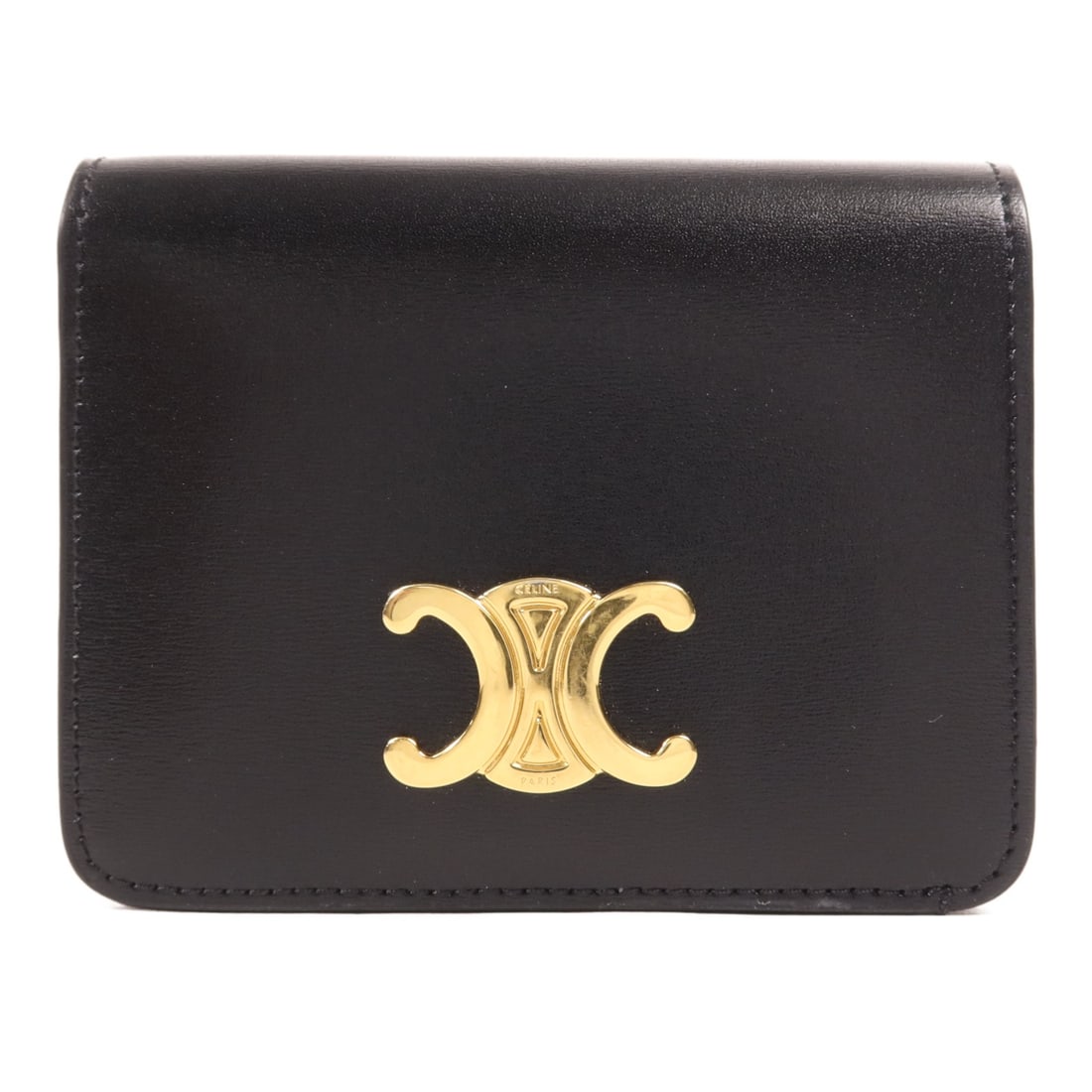 CELINE Triomphe Compact Wallet Black Calfskin Leather GHW: CELINE Triomphe Compact Wallet Black Calfskin Leather GHW Introducing the CELINE Triomphe Compact Wallet, crafted from premium calfskin leather in a classic black hue. This bi-fold wallet combines ele