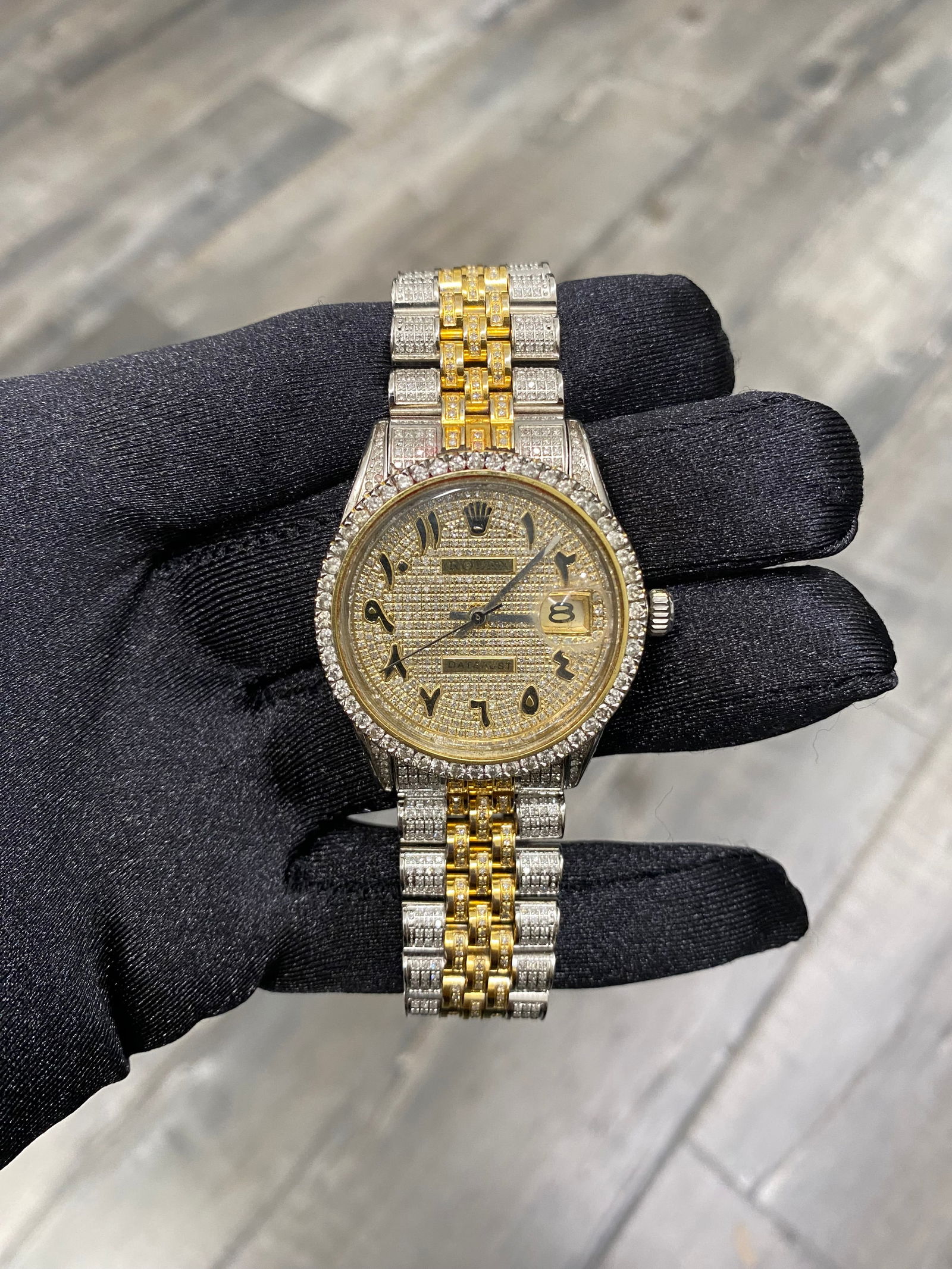 Rolex Datejust 6694 Diamond Arabic Dial After Market Jubilee Watch: Rolex Datejust 6694 Diamond Arabic Dial After Market Jubilee Watch The Rolex Datejust, reference number 6694, is a stunning timepiece featuring a diamond Arabic dial and a diamond bezel, making it an