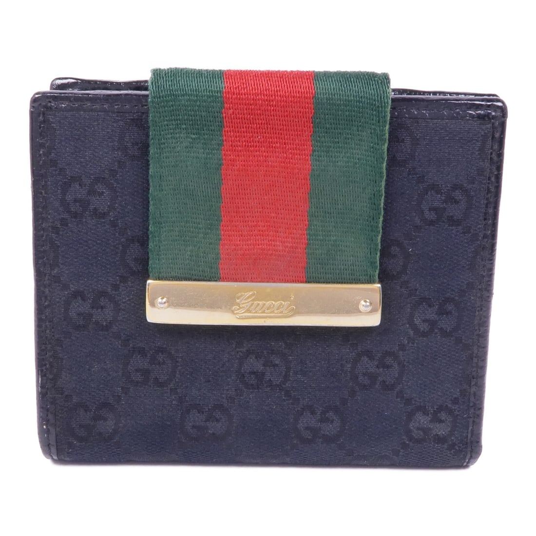 GUCCI Bi-fold Wallet Black GG Canvas Made in Italy: GUCCI Bi-fold Wallet Black GG Canvas Made in Italy This bi-fold wallet from GUCCI showcases a classic design crafted from GG canvas in a sleek black color. It features a compact size that makes it per