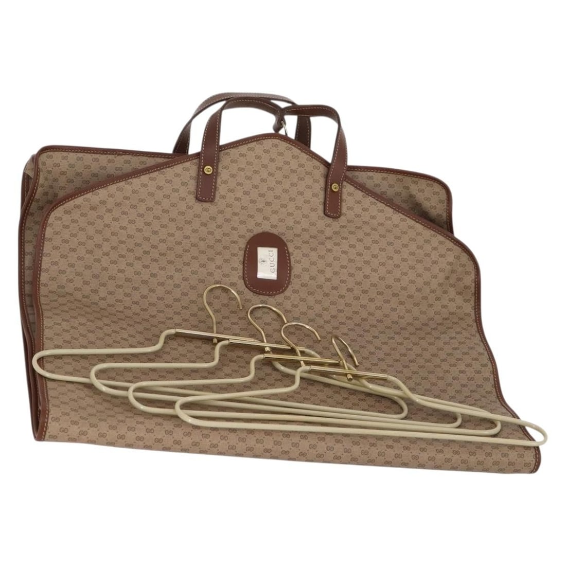 GUCCI Micro GG Supreme Garment Cover Beige Gold PVC Auth 011-067-0472: GUCCI Micro GG Supreme Garment Cover Beige Gold PVC Auth 011-067-0472 This stylish GUCCI Micro GG Supreme Garment Cover is crafted from premium PVC leather in a sophisticated beige and gold color sche