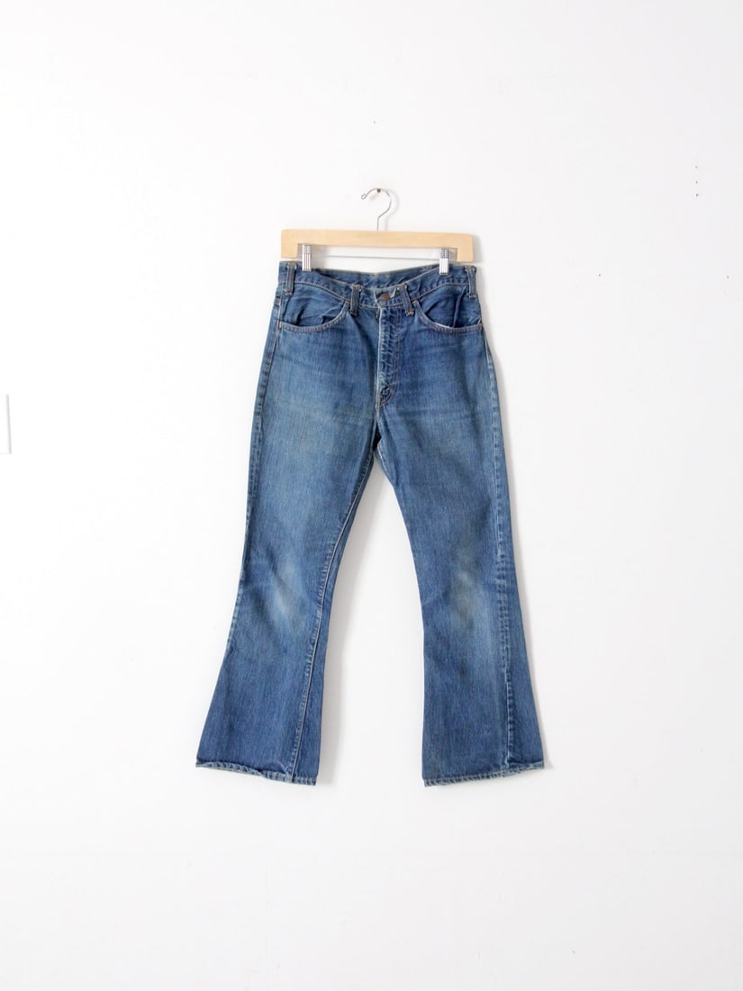 1970s Vintage Levis Bootcut Jeans 31 x 28 Orange Tab: 1970s Vintage Levis Bootcut Jeans 31 x 28 Orange Tab Discover a classic piece of fashion history with these vintage 1970s Levis jeans. Designed in a timeless bootcut style, these jeans sit comfortably
