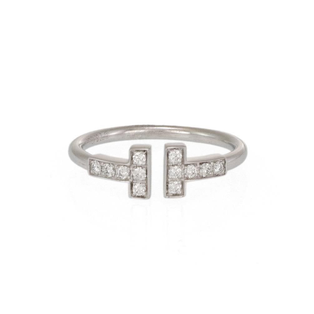 Tiffany T Collection 18k White Gold Cuff Ring with Diamonds Size 9.25: Tiffany T Collection 18k White Gold Cuff Ring with Diamonds Size 9.25 Discover the elegance of the Tiffany T Collection with this authentic cuff band ring crafted by Tiffany & Co. Made from luxurious