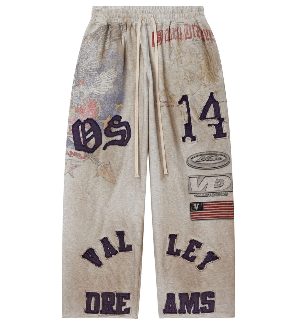 Vale Crash Grey Baggy Sweatpants with Adjustable Drawstring: Vale Crash Grey Baggy Sweatpants with Adjustable Drawstring The Vale Crash Grey Sweatpants offer an ideal combination of comfort and urban style. Made from a premium cotton-blend fleece, these sweatpa