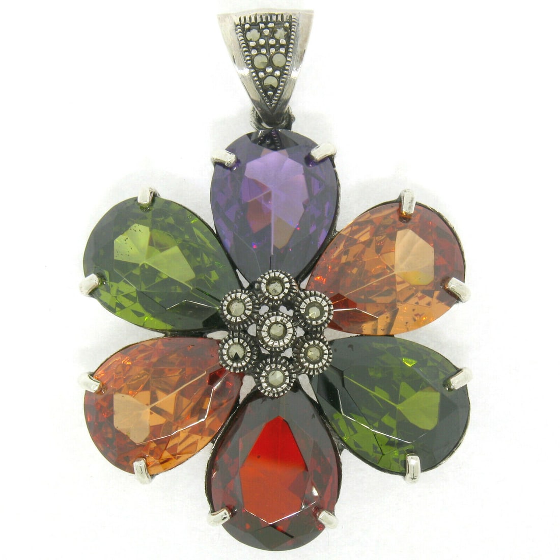 Multi-Colored Simulated Gemstone Sterling Silver Flower Cluster Pendant with Chain: Multi-Colored Simulated Gemstone Sterling Silver Flower Cluster Pendant with Chain This stunning pendant showcases a beautiful flower cluster design crafted from solid .925 sterling silver. It feature