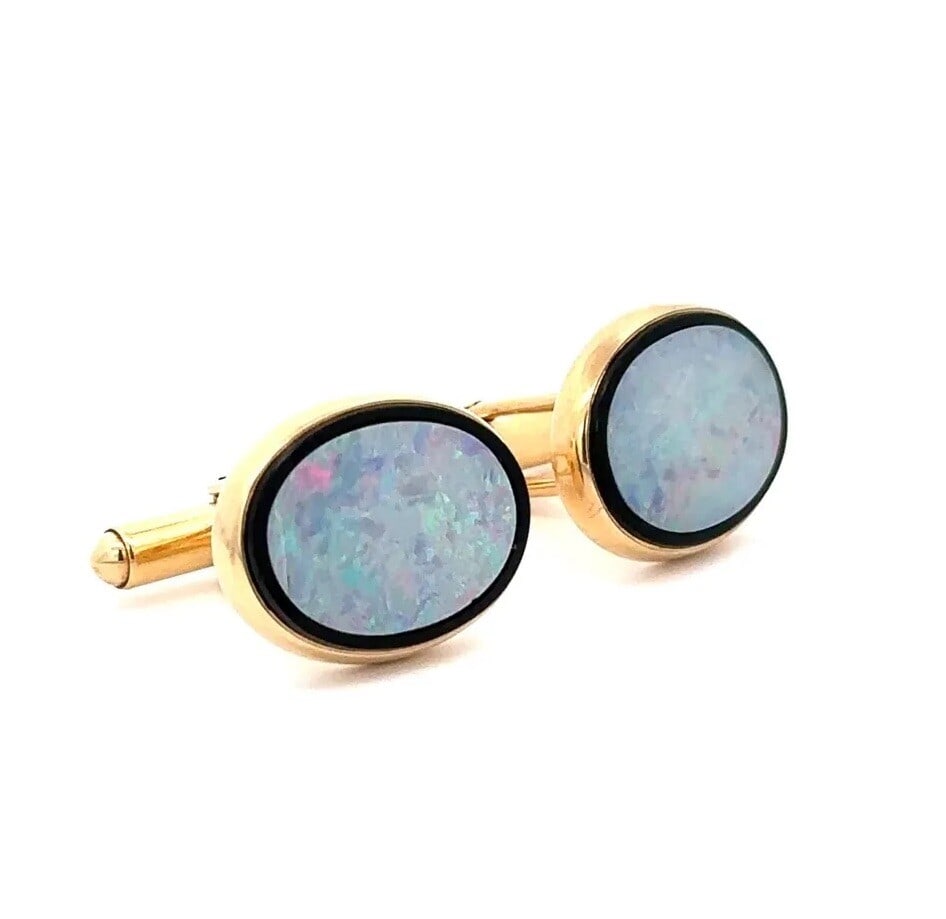 Estate Men's Yellow Gold Cufflinks with Opal and Black Onyx: Estate Men's Yellow Gold Cufflinks with Opal and Black Onyx Elevate your style with these exquisite Men's Estate Cufflinks, featuring a stunning combination of natural white opal and black onyx. Craft