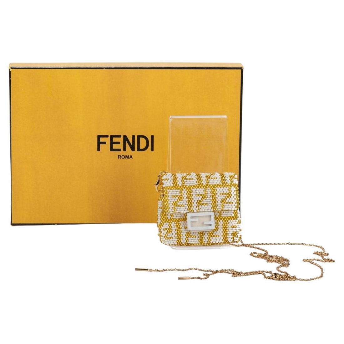 Fendi Micro Baguette Gold Monogram with Chain NIB: Fendi Micro Baguette Gold Monogram with Chain NIB This exquisite Fendi Micro Baguette is a stunning accessory that perfectly embodies luxury and sophistication. Crafted in Italy, this piece features a