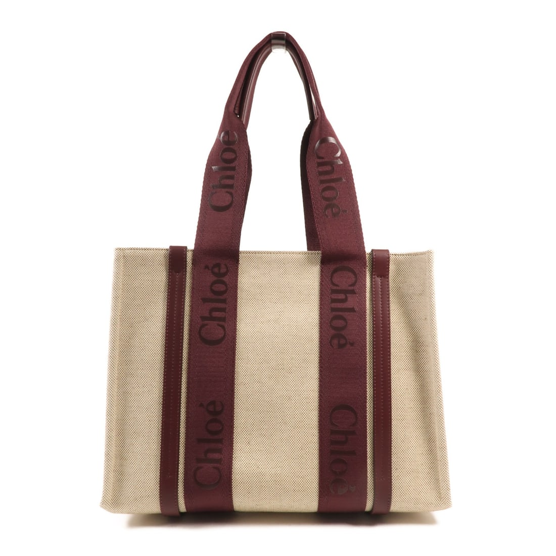 Chloe Woody Medium Tote Bag Linen Leather Beige Burgundy: Chloe Woody Medium Tote Bag Linen Leather Beige Burgundy The Chloe Woody Tote Bag is a stylish medium-sized tote crafted from high-quality leather with a striking red exterior. Designed with practical