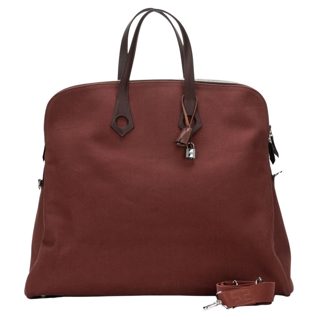 Hermes Heeboo Handbag Toile XXL with Clochette and Lock: Hermes Heeboo Handbag Toile XXL with Clochette and Lock Introducing the Hermes Heeboo Handbag Toile XXL, a luxurious accessory that combines style and functionality. This handbag is crafted in excelle