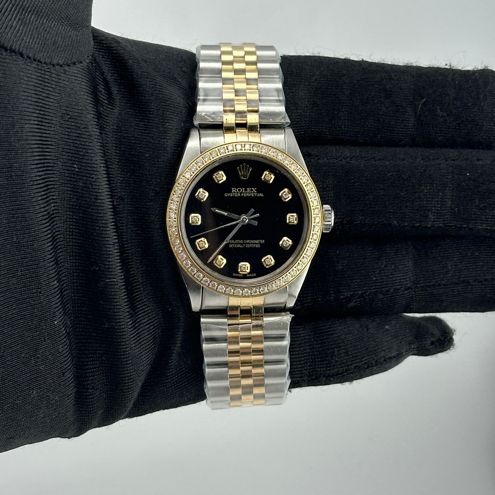 Rolex Oyster Perpetual 6426 Black Diamond Dial Jubilee Bracelet: Rolex Oyster Perpetual 6426 Black Diamond Dial Jubilee Bracelet This stunning Rolex Oyster Perpetual features a captivating Aftermarket Black Diamond dial, complemented by a lavish pave plated diamond