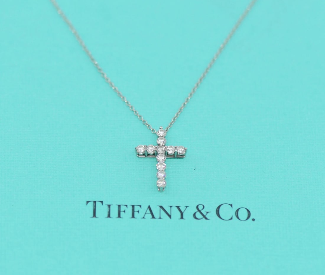 Tiffany & Co Diamond Pendant Cross Necklace Platinum 950 0.66 CTW: Tiffany & Co Diamond Pendant Cross Necklace Platinum 950 0.66 CTW Elevate your jewelry collection with this stunning Tiffany & Co. Diamond Platinum Cross Necklace. This elegant pendant features a beau