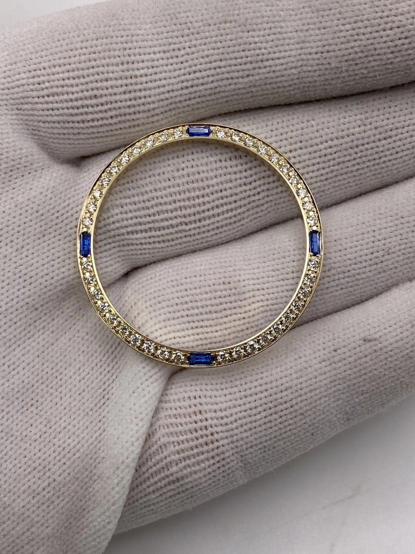 Custom 36mm 14K Yellow Gold Diamond Blue Sapphire Bezel for Rolex Datejust: Custom 36mm 14K Yellow Gold Diamond Blue Sapphire Bezel for Rolex Datejust Elevate your Rolex Datejust with this exquisite custom bezel crafted from 14K yellow gold. Featuring approximately 1 carat