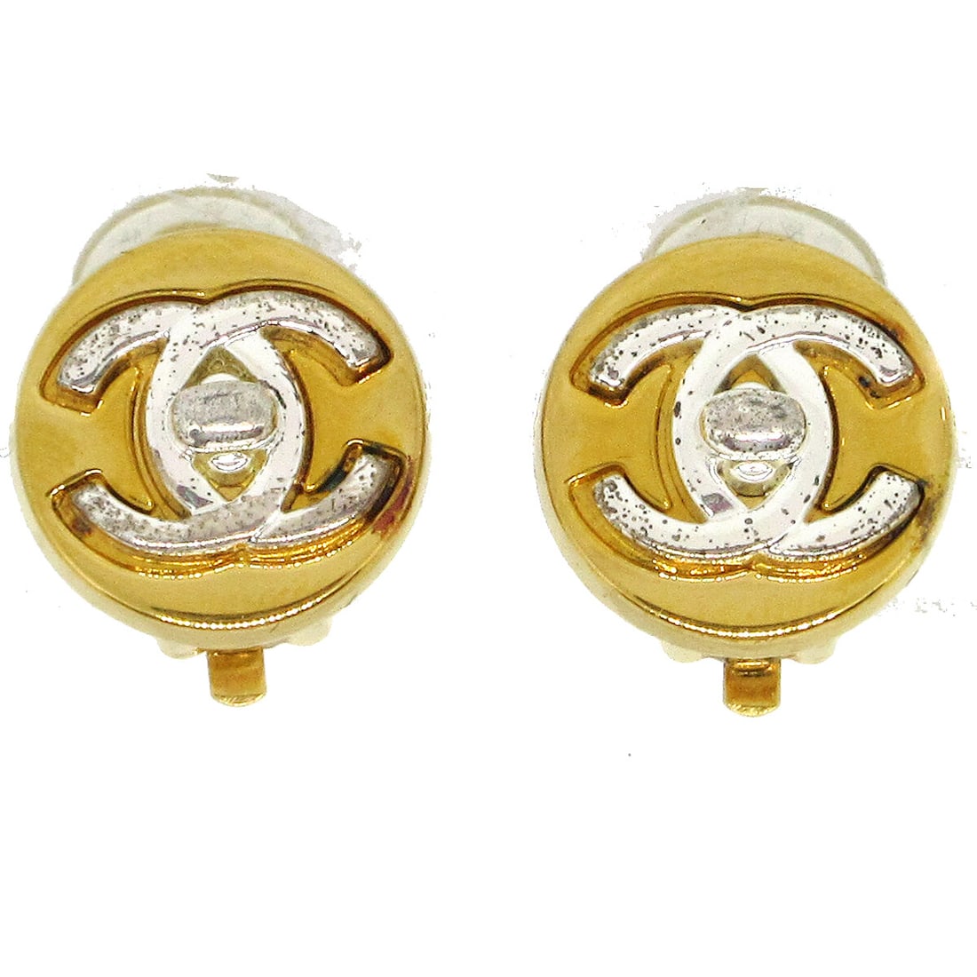 Chanel Turnlock Clip-On Round Earrings Gold Tone Logo 97A: Chanel Turnlock Clip-On Round Earrings Gold Tone Logo 97A These stunning Chanel Turnlock Round Earrings feature a classic button shape and a secure clip-on closure. Crafted in a luxurious gold-tone me