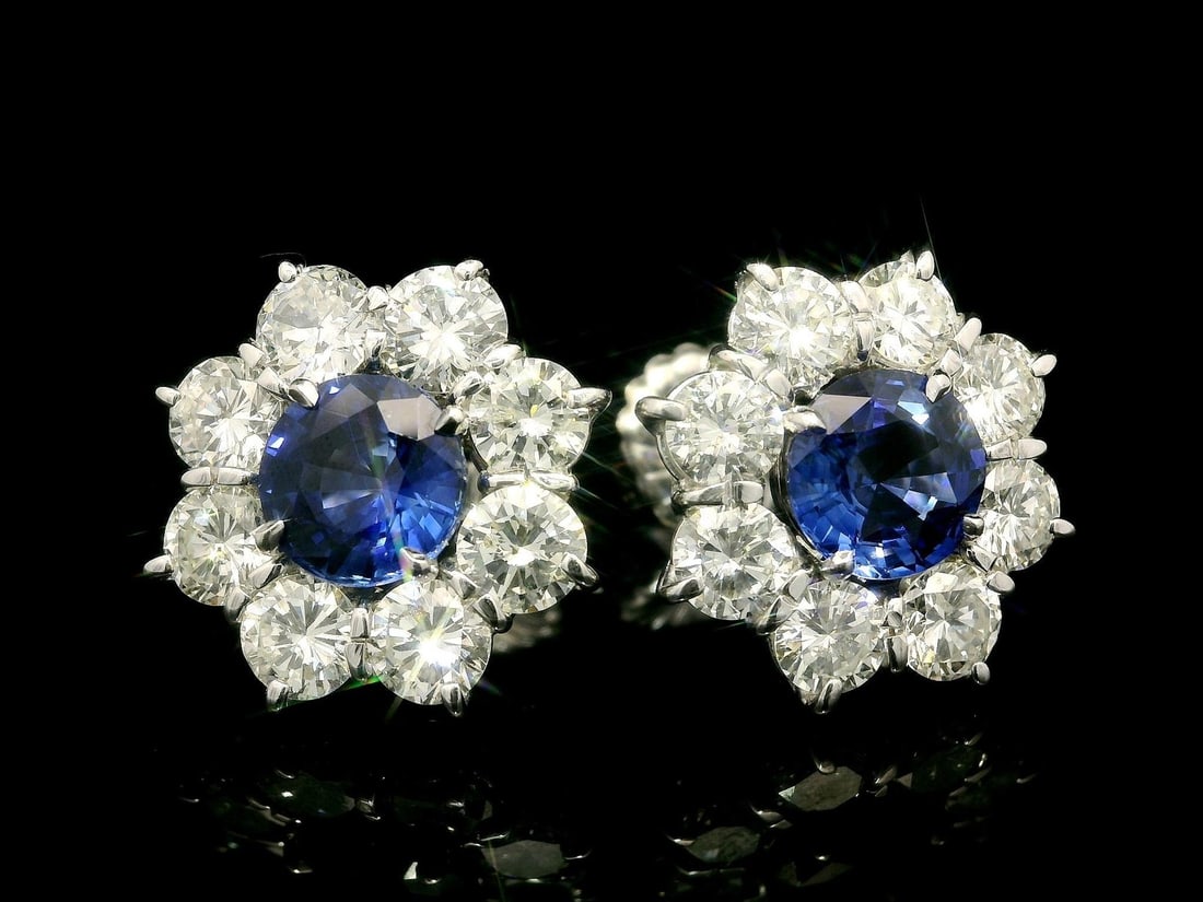 GIA Certified Ceylon Sapphire Diamond Halo Cluster Earrings in White Gold: GIA Certified Ceylon Sapphire Diamond Halo Cluster Earrings in White Gold These stunning earrings feature a large cluster design crafted from solid white gold, showcasing two natural Ceylon sapphires