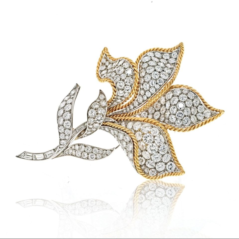 Stunning Platinum and 18K Yellow Gold 25ct Diamond Flower Brooch: Stunning Platinum and 18K Yellow Gold 25ct Diamond Flower Brooch This exquisite brooch features a stunning combination of platinum and 18K yellow gold, showcasing a captivating flower design adorned w