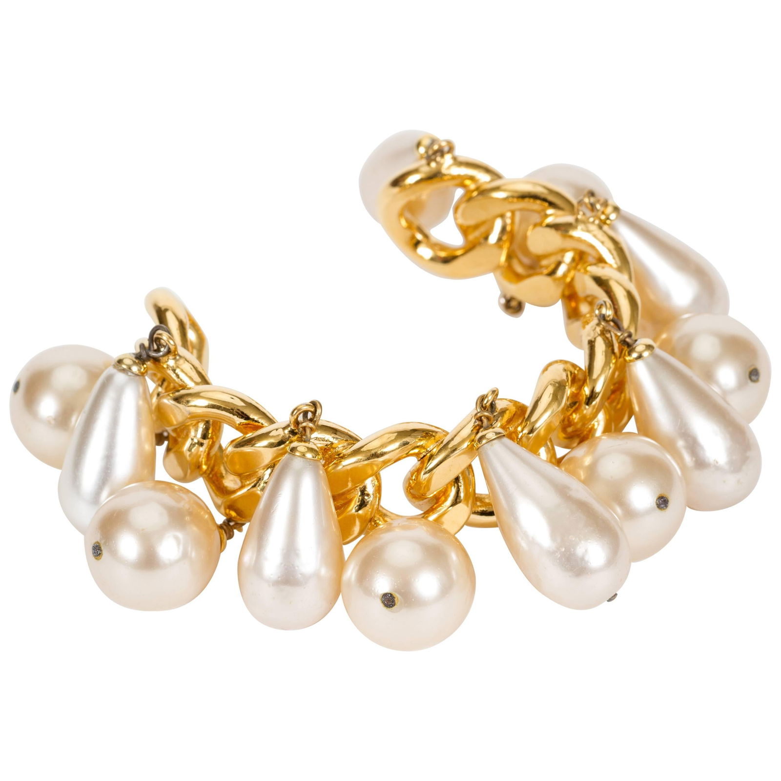 Chanel 1980s Pearl Charm Chain Cuff Bracelet Collection 23: Chanel 1980s Pearl Charm Chain Cuff Bracelet Collection 23 This exquisite Chanel Pearl Charm Chain Cuff Bracelet features a stunning design from the 1980's, showcasing a runway-inspired chain with ele