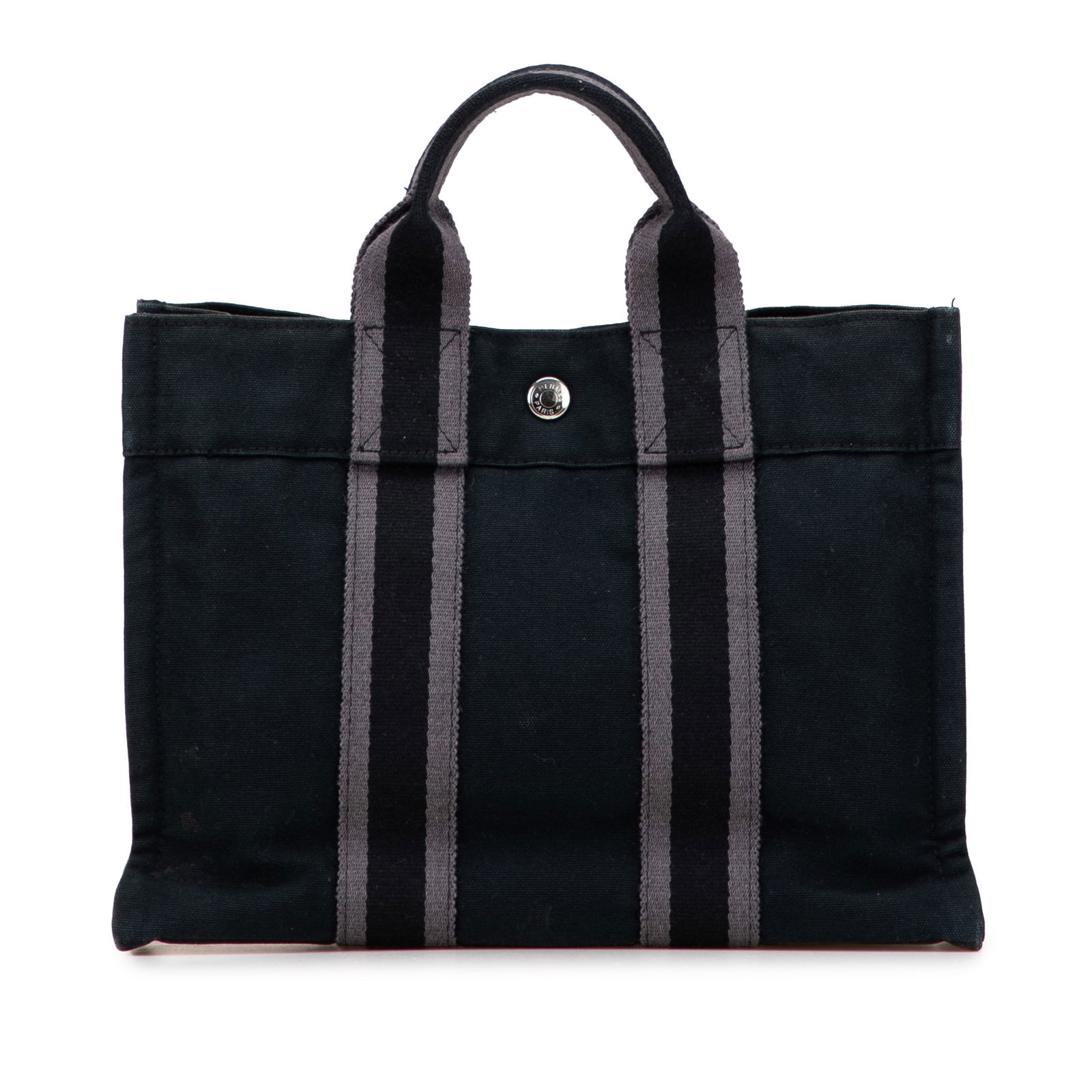 Hermes Canvas Fourre Tout PM Black Tote Bag: Hermes Canvas Fourre Tout PM Black Tote Bag The Hermes Canvas Fourre Tout PM tote is a stylish and versatile accessory, featuring a durable canvas body and flat straps for easy carrying. This tote has