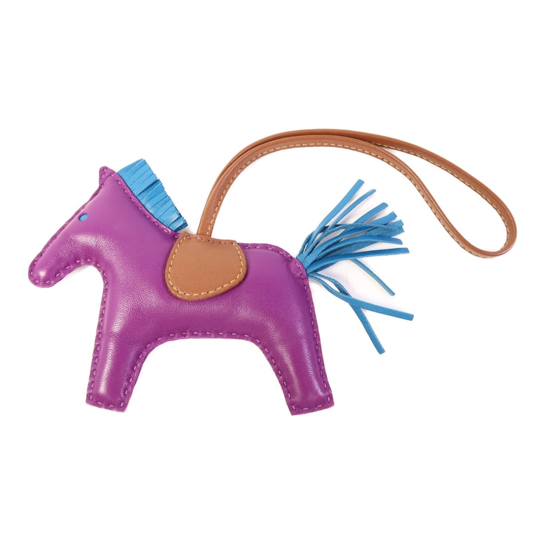 HERMES Rodeo MM Charm Purple Blue Lambskin Leather: HERMES Rodeo MM Charm Purple Blue Lambskin Leather Introducing the HERMES Rodeo MM Charm, crafted from luxurious lambskin leather in a striking purple hue. This charming accessory adds a playful touch
