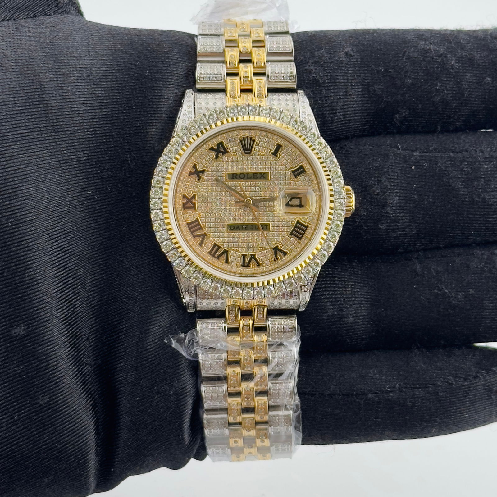 Rolex Datejust 36mm Iced Out Roman Dial Jubilee Bracelet Ref 1601: Rolex Datejust 36mm Iced Out Roman Dial Jubilee Bracelet Ref 1601 This exquisite Rolex Datejust showcases an Iced Out Roman dial, designed specifically for men. The watch features a luxurious prong pl