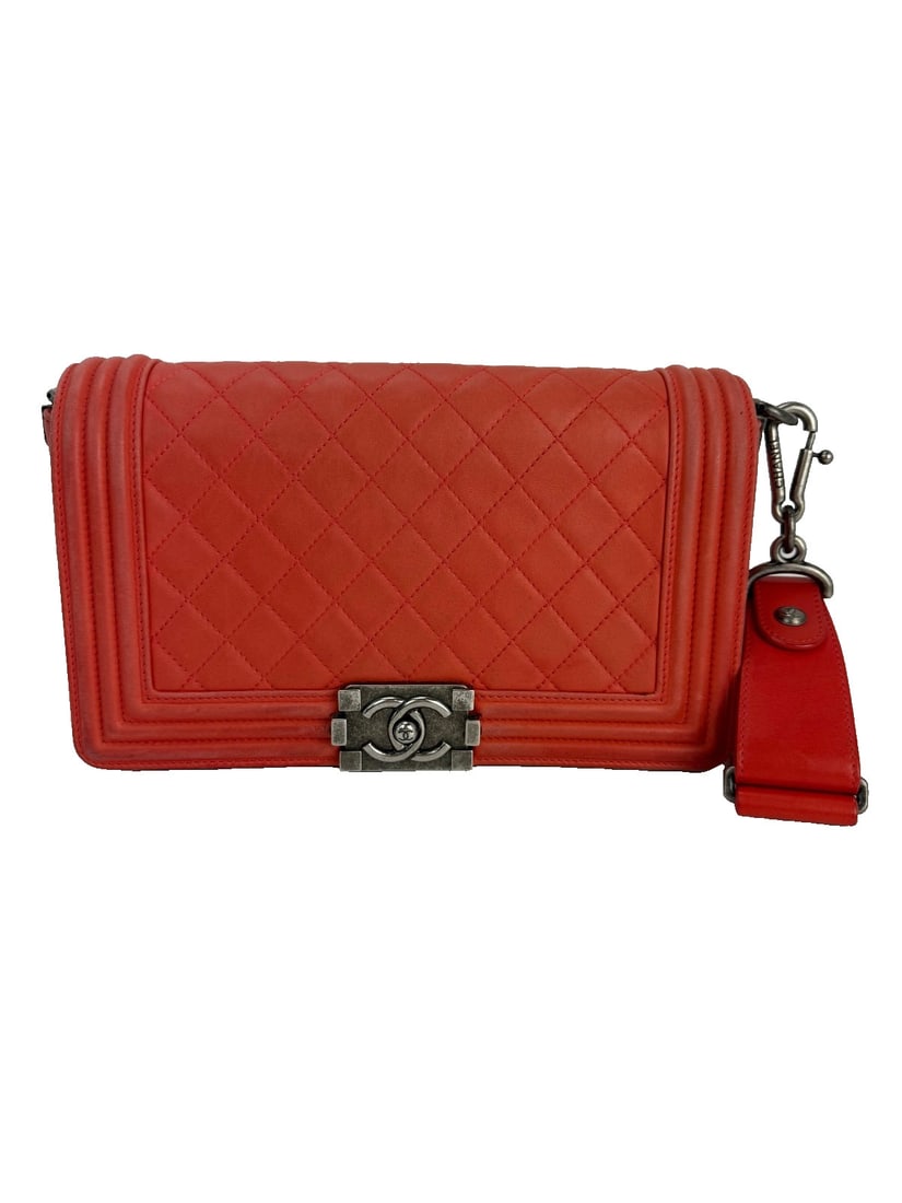 CHANEL Medium Boy Flap Bag Red Lambskin Quilted with Antique Silver Hardware: CHANEL Medium Boy Flap Bag Red Lambskin Quilted with Antique Silver Hardware Elevate your style with the CHANEL Lambskin Quilted Medium Boy Flap Bag, a stunning accessory perfect for casual parties, c