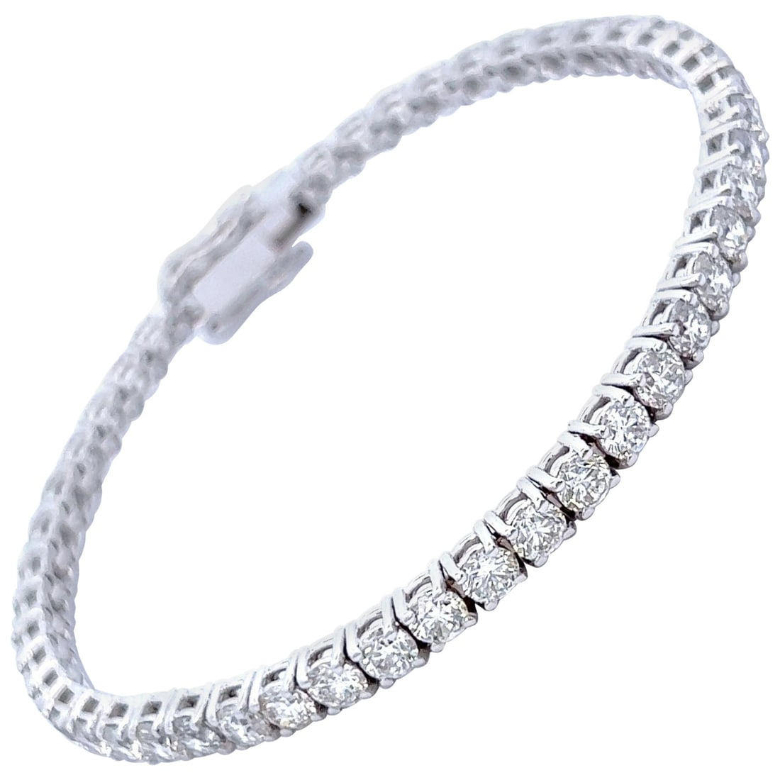 9.19ct Diamond Tennis Bracelet in 18k White Gold: 9.19ct Diamond Tennis Bracelet in 18k White Gold This exquisite 9.19ct Diamond Tennis Bracelet is crafted in luxurious 18k white gold, featuring 49 round brilliant diamonds that showcase a dazzling F/