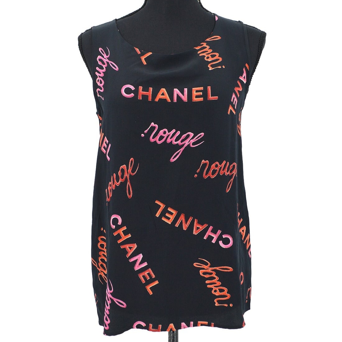 Chanel Vintage 90s Black Silk Sleeveless Top Size 38: Chanel Vintage 90s Black Silk Sleeveless Top Size 38 Elevate your casual wardrobe with this vintage Chanel sleeveless top, a timeless piece from the 90s. Crafted from luxurious 100% silk, this black t
