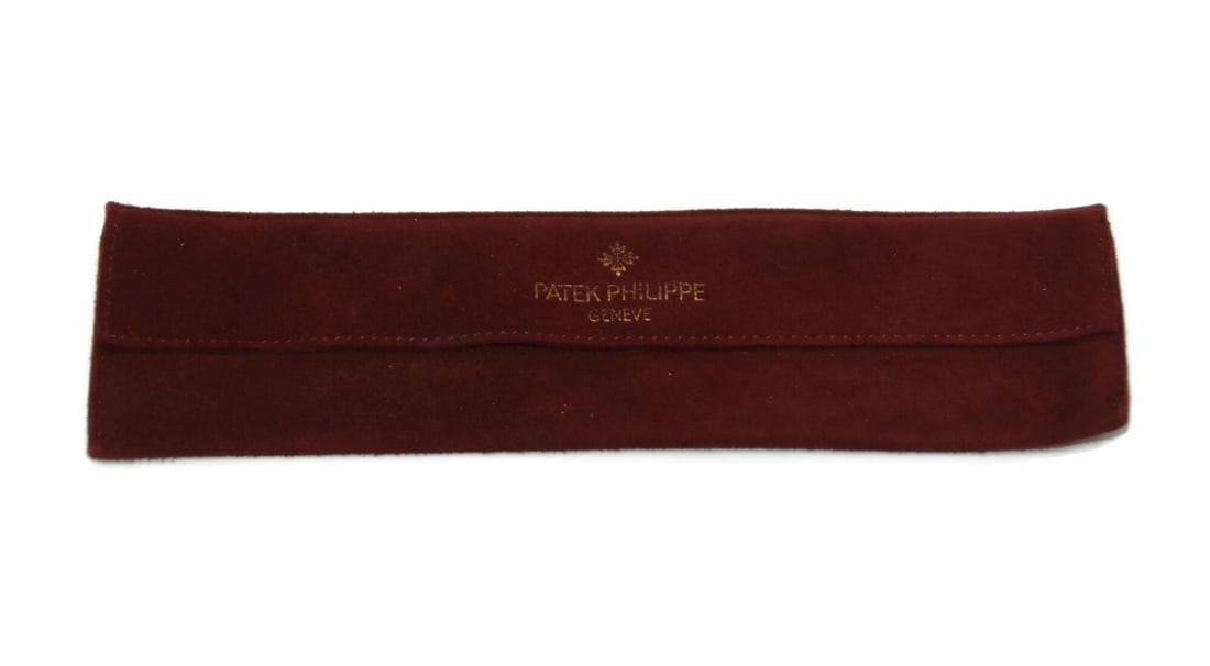 Patek Philippe Red Fabric Travel Watch Pouch 9x2 Inches Authentic: Patek Philippe Red Fabric Travel Watch Pouch 9x2 Inches Authentic This Patek Philippe Cloth Watch Pouch is an essential travel accessory for watch enthusiasts. Crafted from durable fabric, it features