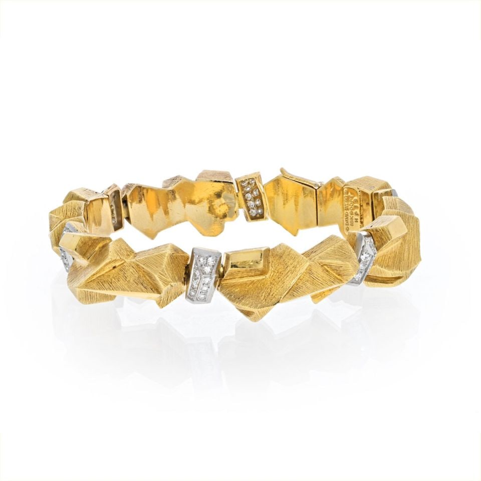 David Webb 18K Gold Nugget Diamond Bracelet with Certificate: David Webb 18K Gold Nugget Diamond Bracelet with Certificate This exquisite articulated bracelet by David Webb features a stunning combination of 18K yellow gold and platinum. The design is inspired b