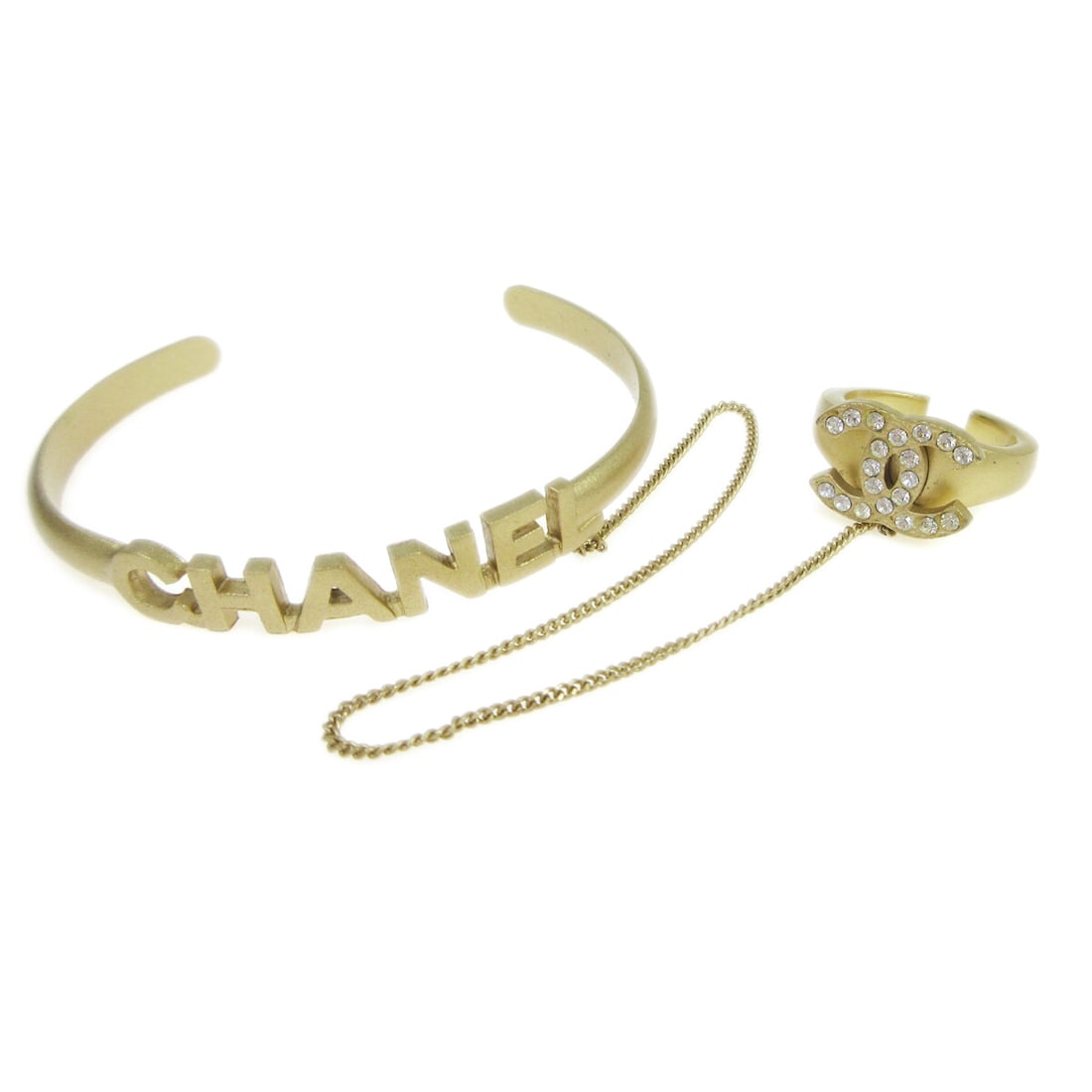 Chanel Gold-tone Rhinestone Bangle Bracelet 5.9 Inches 01C: Chanel Gold-tone Rhinestone Bangle Bracelet 5.9 Inches 01C This exquisite Chanel bangle features a stylish chain design adorned with sparkling rhinestones. The bracelet is crafted in a stunning gold-t