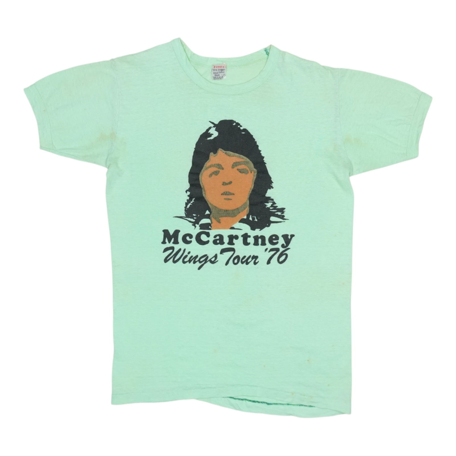 Vintage 1976 Paul McCartney Wings Tour Shirt Green: Vintage 1976 Paul McCartney Wings Tour Shirt Green Experience a piece of music history with this original vintage 1976 Paul McCartney Wings Tour Shirt. Celebrating the iconic tour, this shirt is a gen