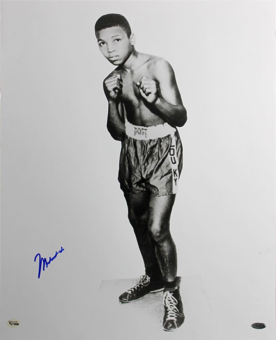 Muhammad Ali Signed 16X20 Childhood Photo with Steiner Hologram: Muhammad Ali Signed 16X20 Childhood Photo with Steiner Hologram This authentic signed 16x20 black and white photo captures Muhammad Ali as a child, showcasing a significant piece of boxing memorabilia