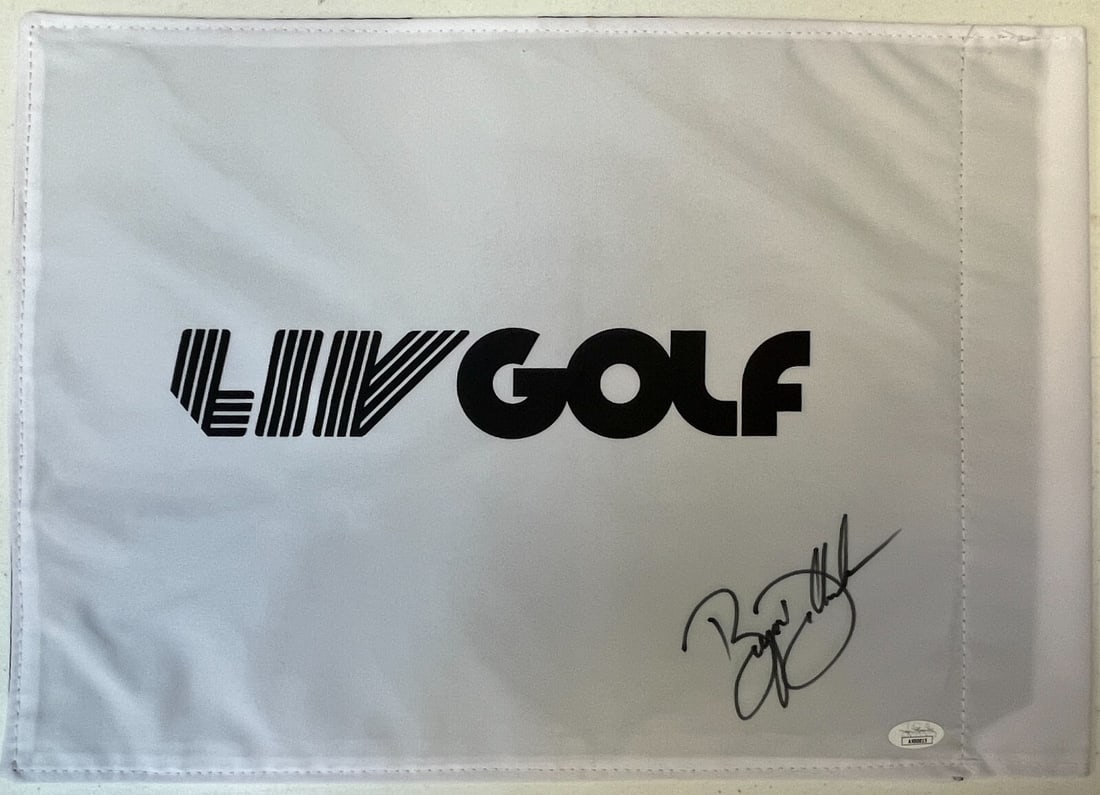 Bryson DeChambeau Signed LIV Golf Flag JSA Authenticated: Bryson DeChambeau Signed LIV Golf Flag JSA Authenticated Celebrate the excitement of golf with this officially licensed LIV Golf pin flag, beautifully signed by PGA and LIV star Bryson DeChambeau. Thi