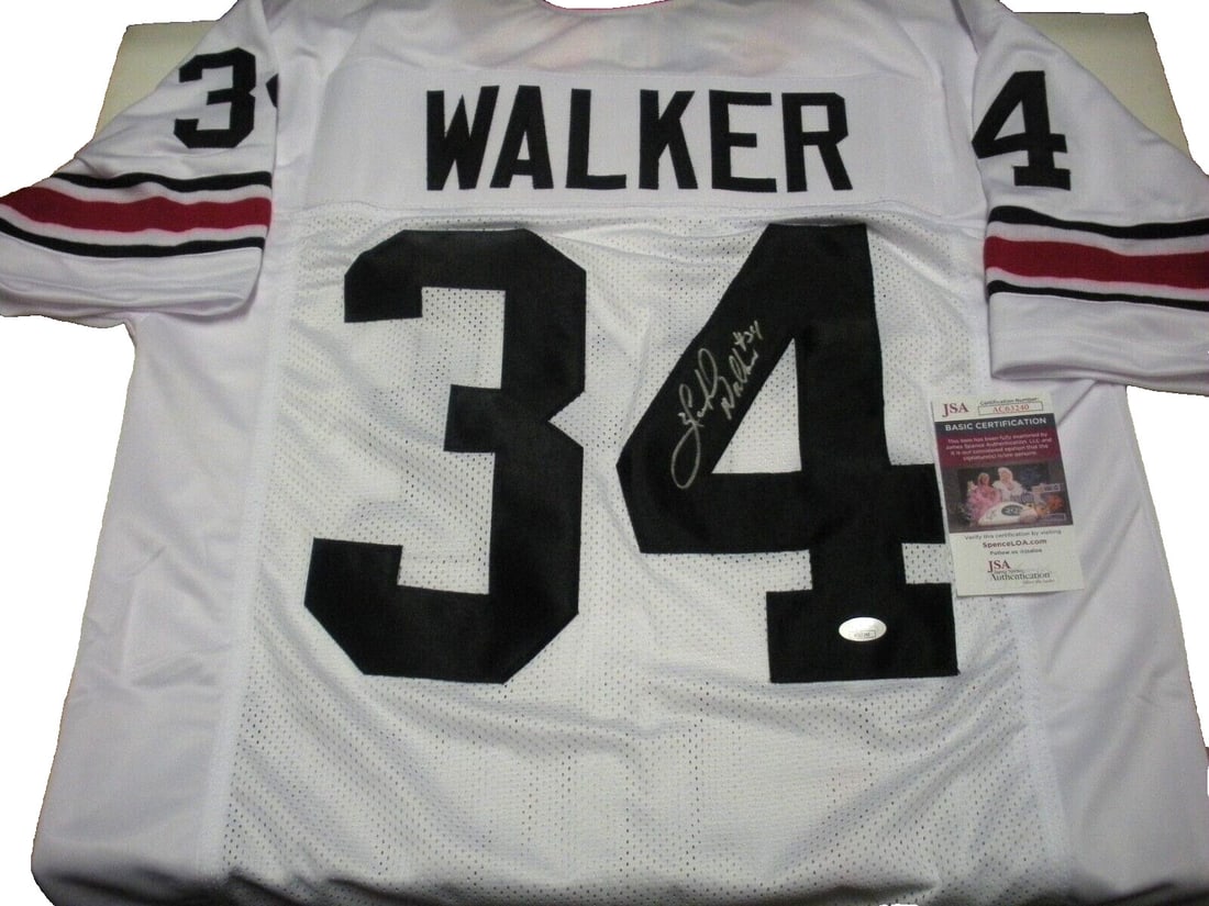Herschel Walker Georgia Bulldogs Signed Heisman 82 Jersey Beckett COA: Herschel Walker Georgia Bulldogs Signed Heisman 82 Jersey Beckett COA This officially licensed jersey features Herschel Walker, a celebrated player associated with the Georgia Bulldogs, and is a rare 