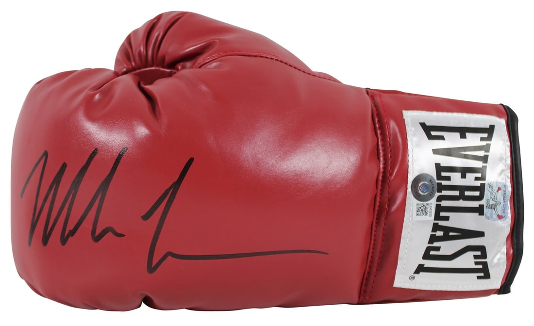 Mike Tyson Signed Red Everlast Boxing Glove with BAS Authentication: Mike Tyson Signed Red Everlast Boxing Glove with BAS Authentication This authentic left-handed red Everlast boxing glove has been personally signed by the legendary boxer Mike Tyson. The glove is cert