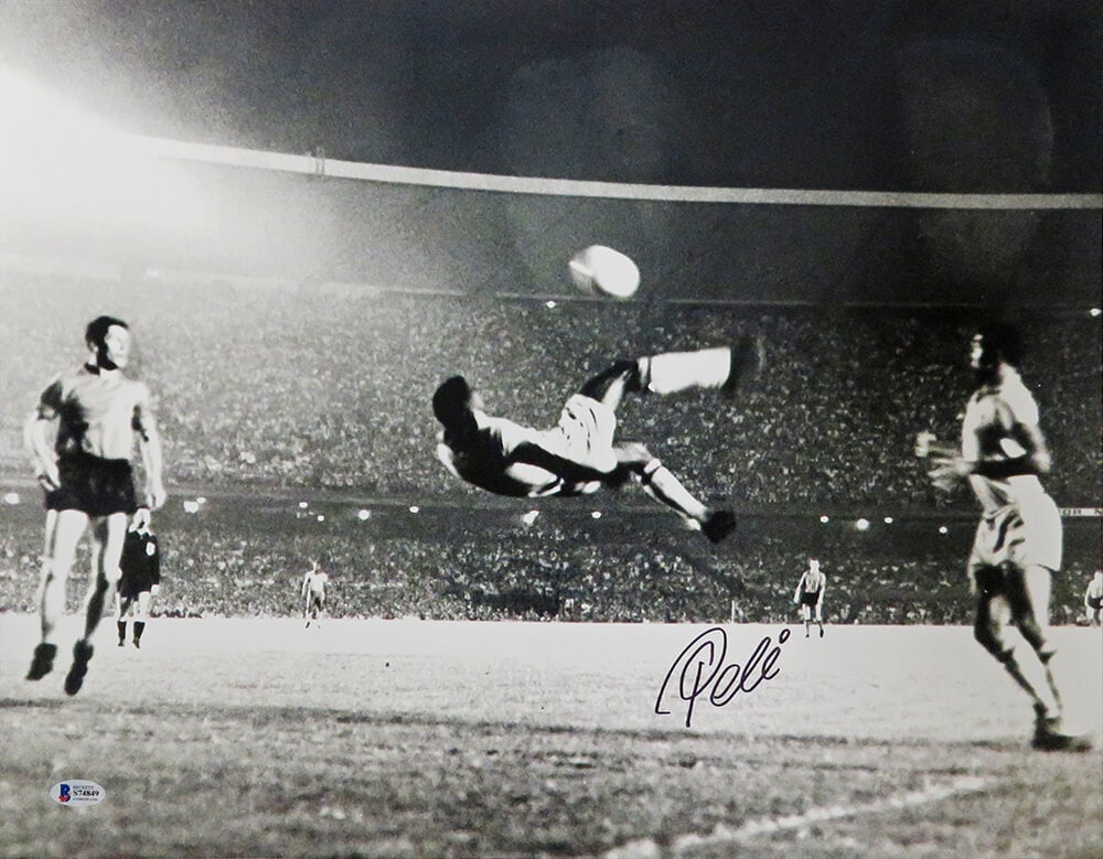 Pele Signed 16x20 B&W Soccer Kick Photo with Beckett Authentication: Pele Signed 16x20 B&W Soccer Kick Photo with Beckett Authentication Capture a moment of soccer history with this Pele Signed Brazil Soccer Black & White Action Kick 16x20 Photo. This original piece fe