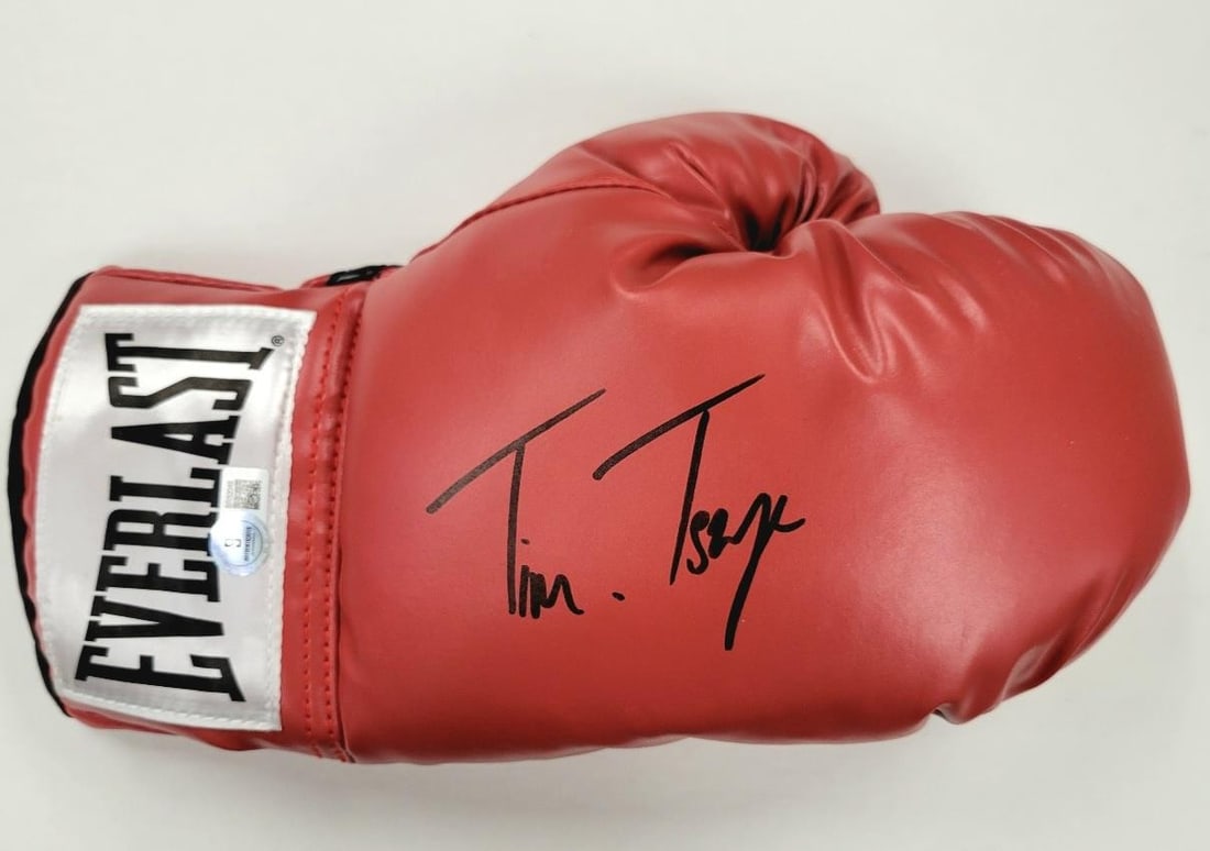 Tim Tszyu Signed Everlast Boxing Glove with Beckett Authentication: Tim Tszyu Signed Everlast Boxing Glove with Beckett Authentication This authentic boxing glove features the signature of the renowned boxer Isaac Cruz, adding a unique collectible aspect to this item.