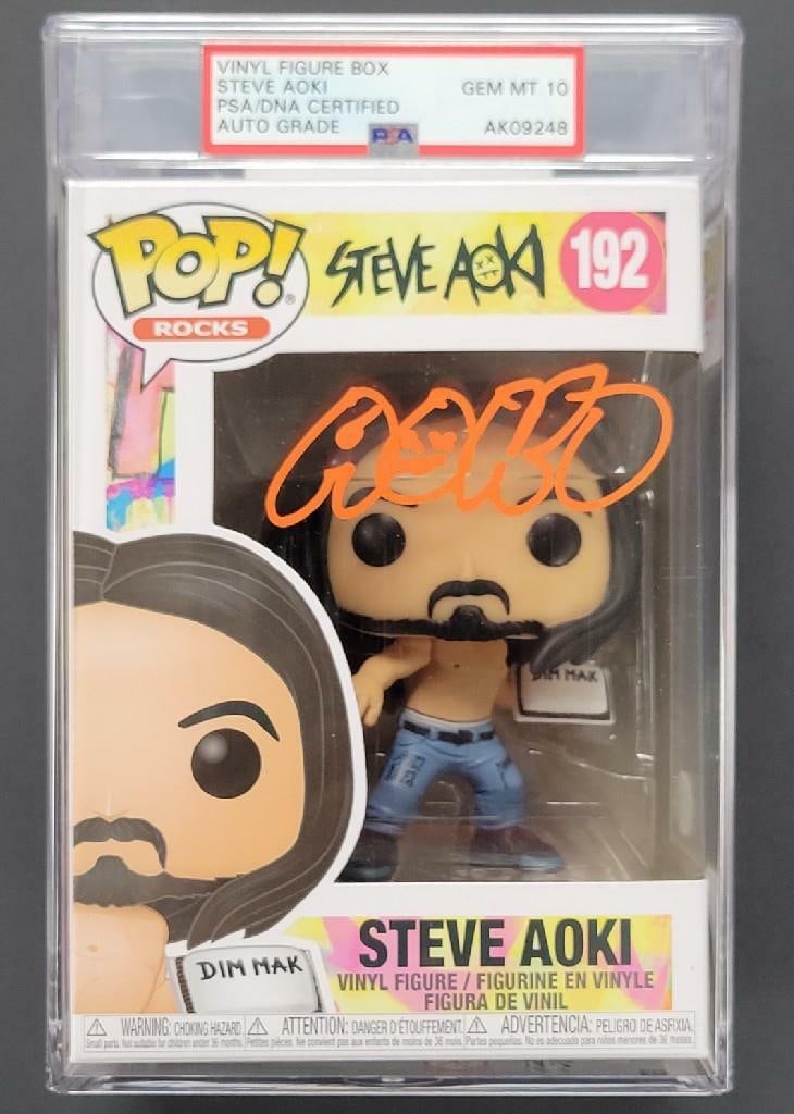 Steve Aoki Signed Funko POP DJ Dim Mak Gem Mint PSA 10: Steve Aoki Signed Funko POP DJ Dim Mak Gem Mint PSA 10 This collectible item features a Funko POP figure of DJ Dim Mak, personally signed by renowned DJ Steve Aoki. The autograph has been authenticate