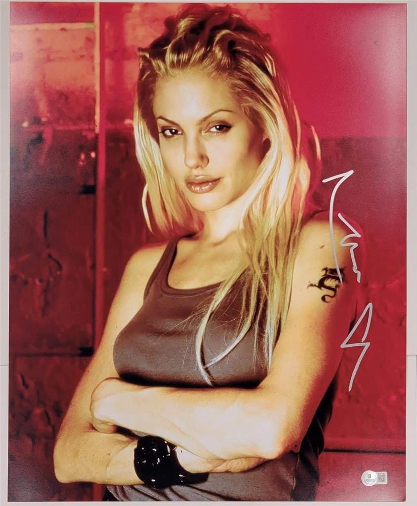 Angelina Jolie Autographed Gone in 60 Seconds 16x20 Photo Beckett Certified: Angelina Jolie Autographed Gone in 60 Seconds 16x20 Photo Beckett Certified This is an original 16x20 photograph from the movie "Tomb Raider," signed by the talented Angelina Jolie. The autograph has