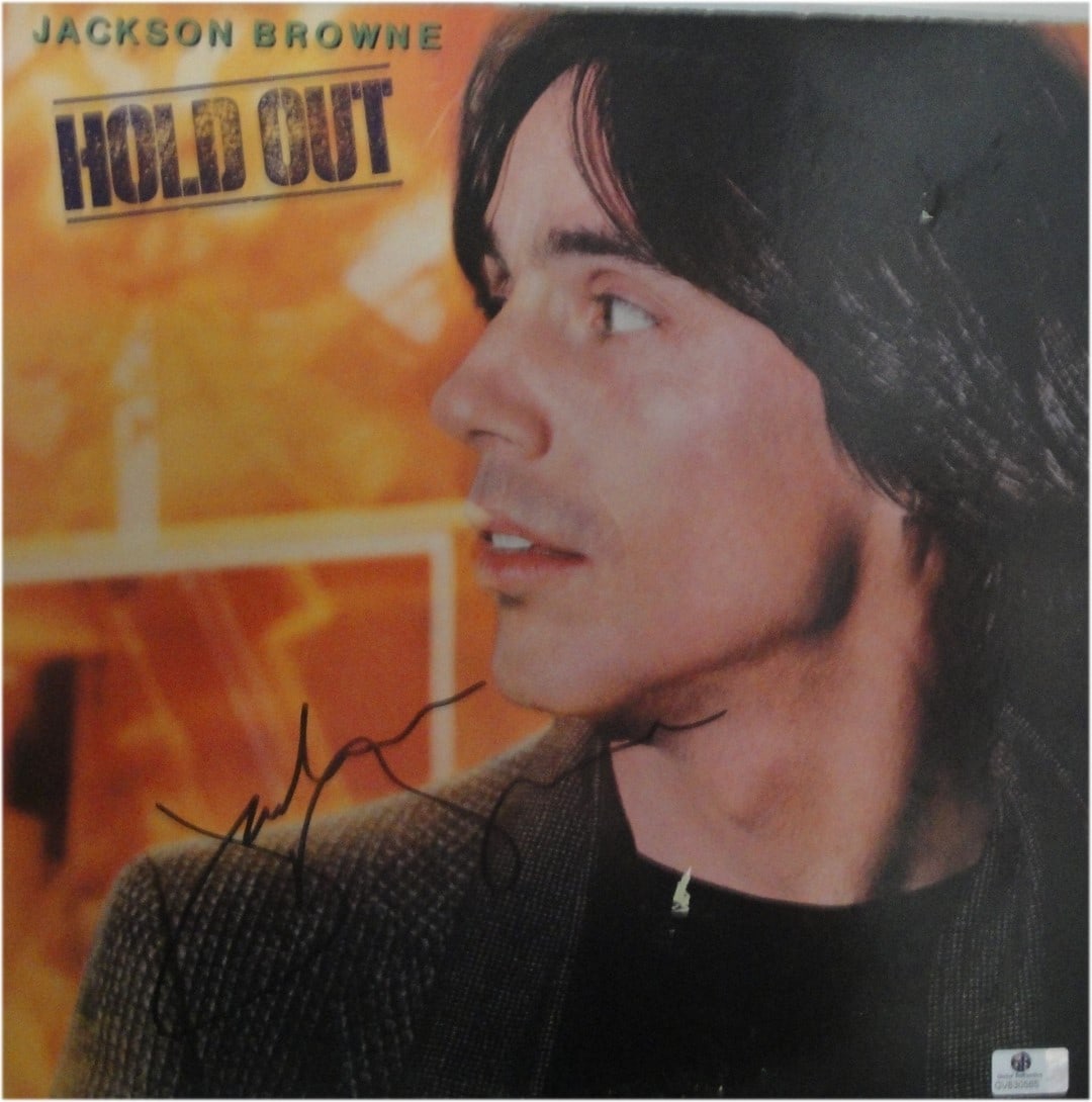 Jackson Browne Autographed Hold Out Record Cover Certified by GAI: Jackson Browne Autographed Hold Out Record Cover Certified by GAI This item features a hand-signed autographed record of Jackson Browne, showcasing a collectible cover with some wear. The record is in