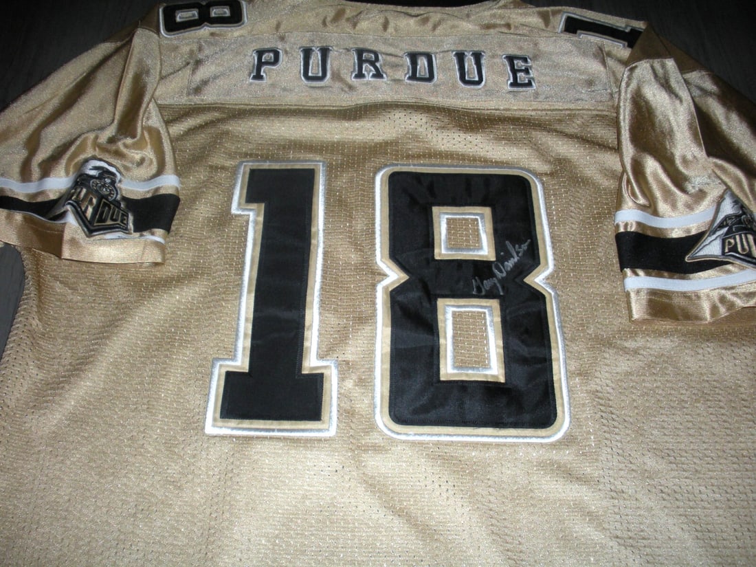 Gary Danielson Signed Purdue Boilermakers Jersey with COA: Gary Danielson Signed Purdue Boilermakers Jersey with COA This officially licensed Purdue Boilermakers jersey, signed by Gary Danielson, is a must-have for any football fan. Featuring authentic collec