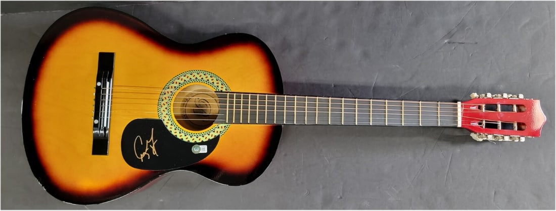 Craig Morgan Autographed Acoustic Guitar Certified by Beckett: Craig Morgan Autographed Acoustic Guitar Certified by Beckett This is a pre-owned acoustic guitar personally autographed by country music artist Craig Morgan. The autograph has been authenticated by B